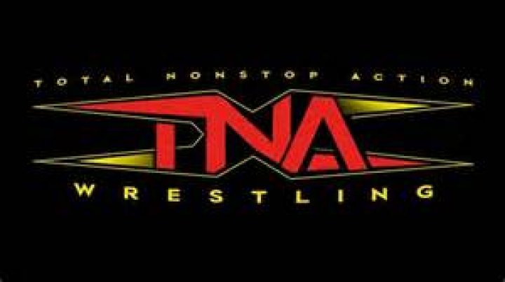 Paige under mask in TNA
